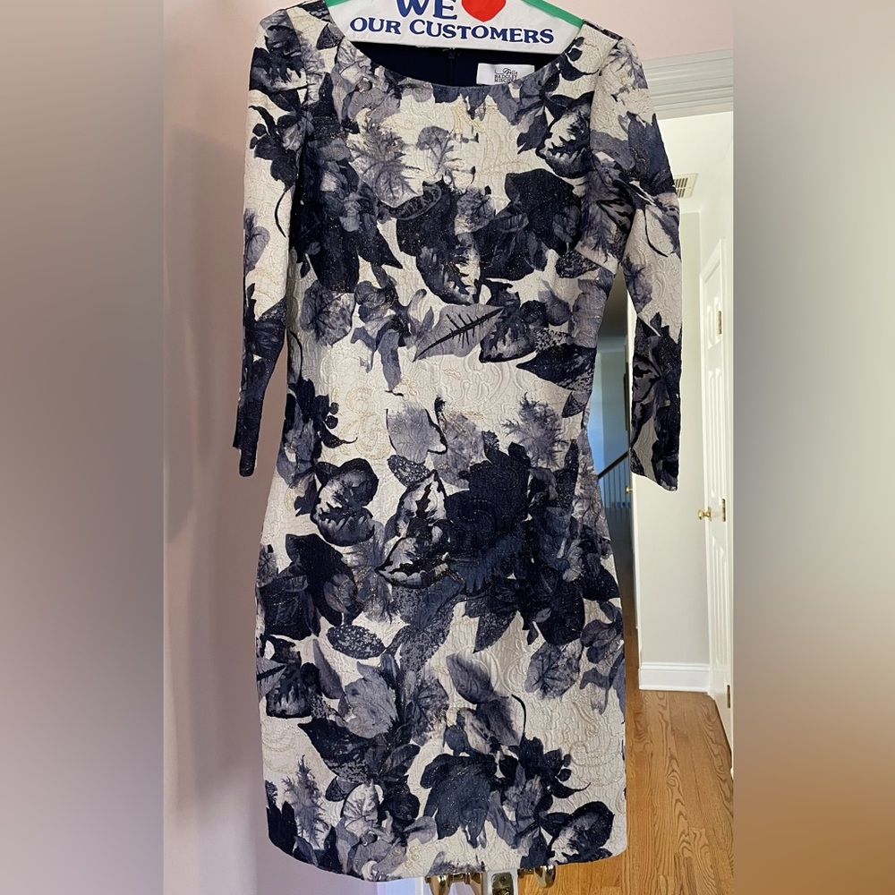 White and floral Badgley Mischka dress with gold accent and 3/4 sleeve length